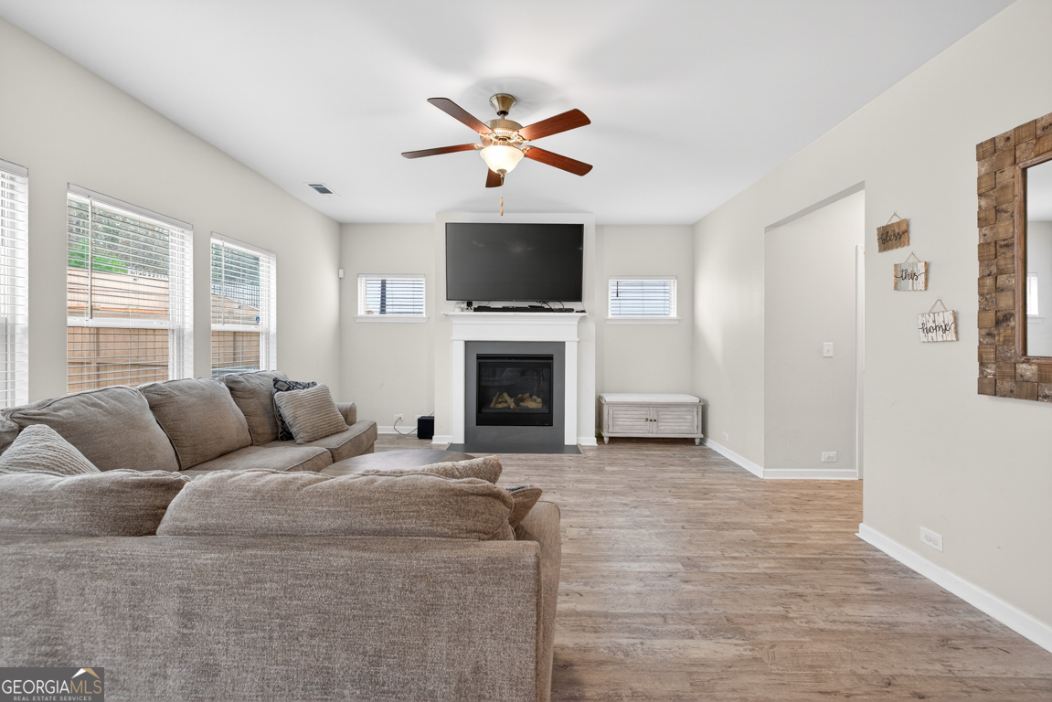3511 Argent Way Marietta, GA 30008 - Photo 32 of 56 a living room with furniture and a fireplace