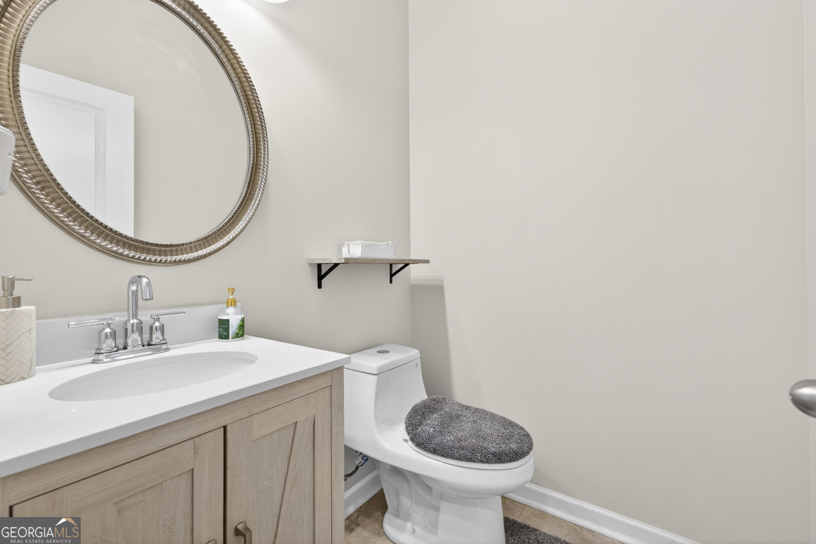 3511 Argent Way Marietta, GA 30008 - Photo 34 of 56 a bathroom with a sink a toilet and a mirror