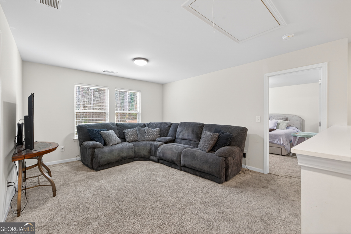 3511 Argent Way Marietta, GA 30008 - Photo 36 of 56 a living room with furniture and a flat screen tv