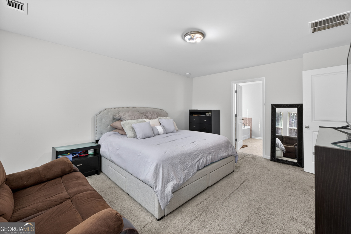 3511 Argent Way Marietta, GA 30008 - Photo 38 of 56 a bedroom with a bed and a couch