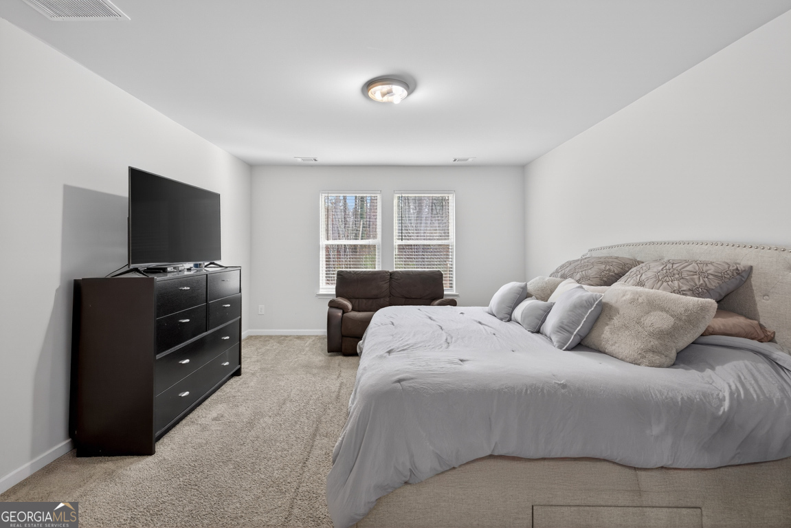 3511 Argent Way Marietta, GA 30008 - Photo 39 of 56 a bedroom with a bed and a flat screen tv