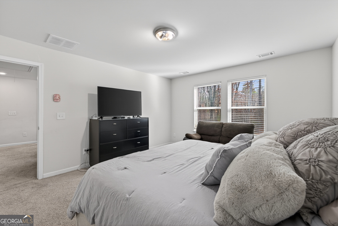 3511 Argent Way Marietta, GA 30008 - Photo 40 of 56 a bedroom with a bed and a flat screen tv