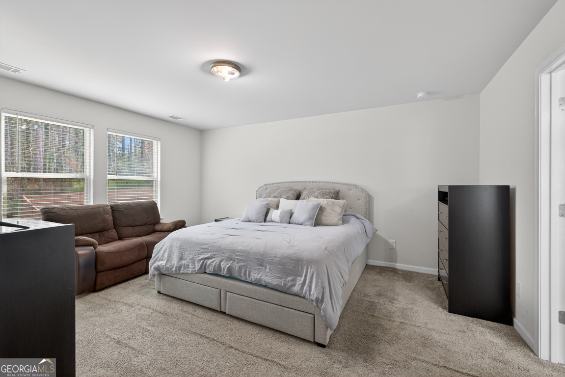 3511 Argent Way Marietta, GA 30008 - Photo 41 of 56 a bedroom with a bed couch and a window