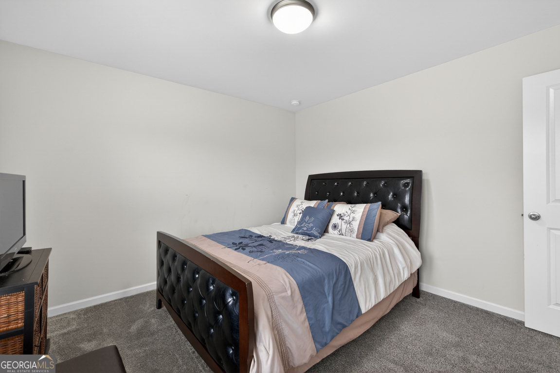 3511 Argent Way Marietta, GA 30008 - Photo 42 of 56 a bedroom with a bed and a television