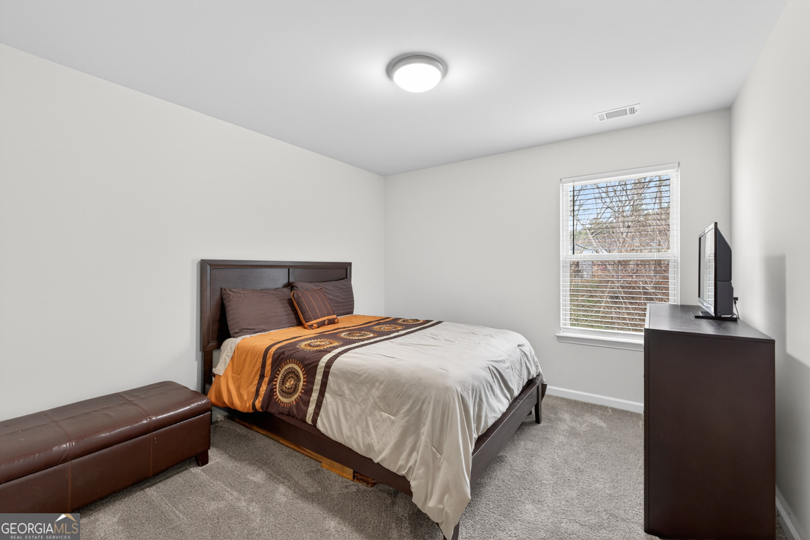 3511 Argent Way Marietta, GA 30008 - Photo 45 of 56 a bedroom with a bed and a window