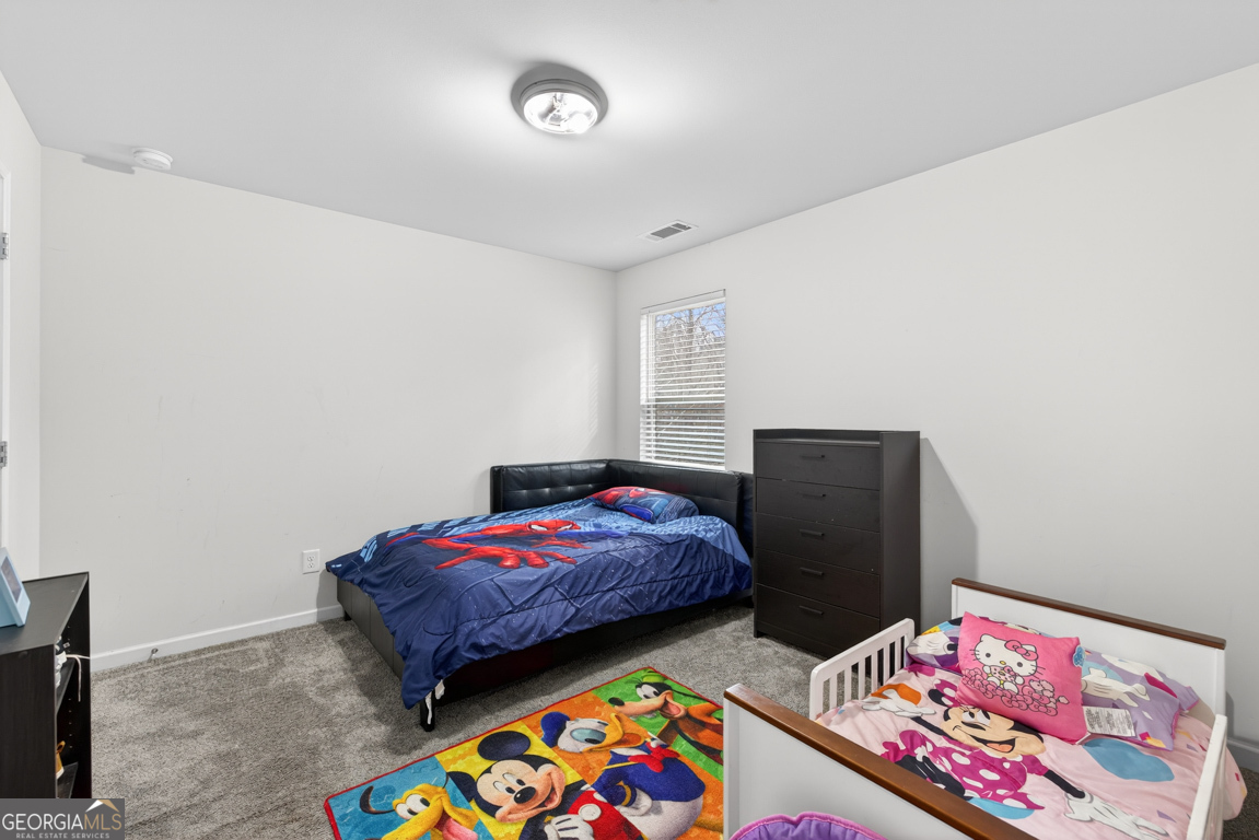 3511 Argent Way Marietta, GA 30008 - Photo 47 of 56 a bedroom with two beds and a dresser