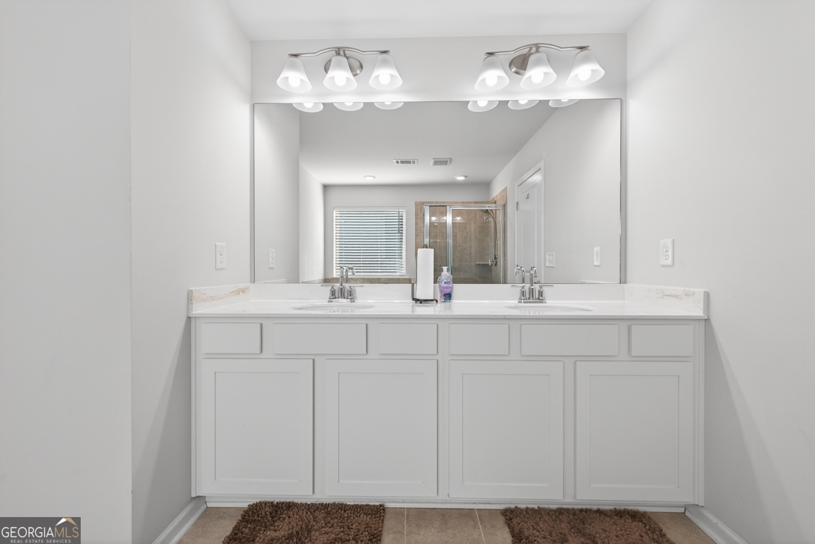 3511 Argent Way Marietta, GA 30008 - Photo 52 of 56 a bathroom with a sink and a mirror