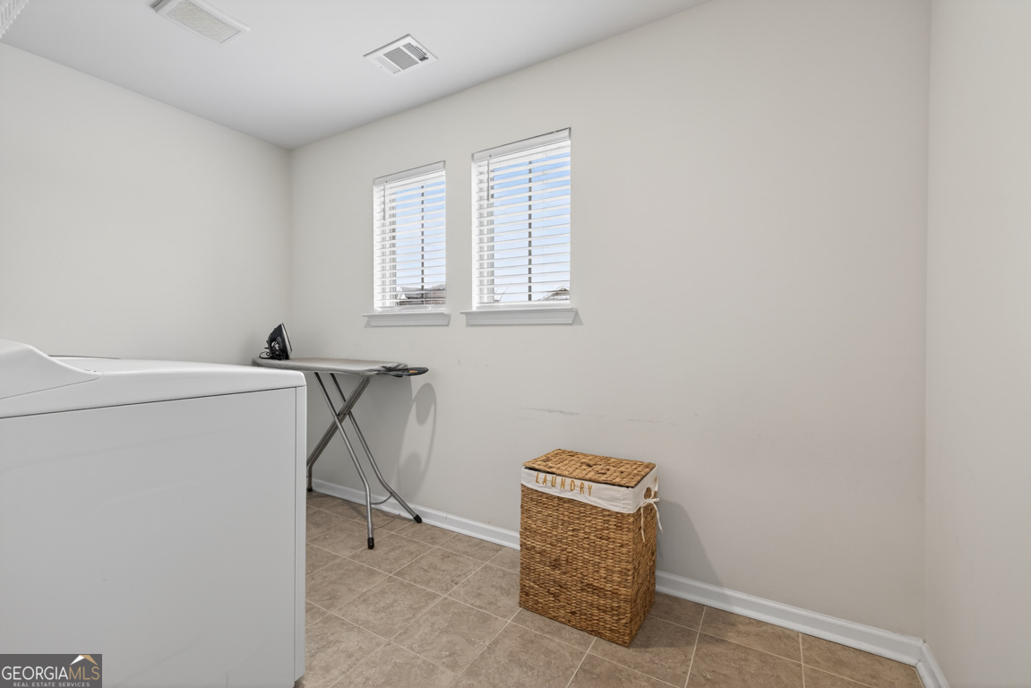 3511 Argent Way Marietta, GA 30008 - Photo 53 of 56 a view of storage and utility room with washer and dryer
