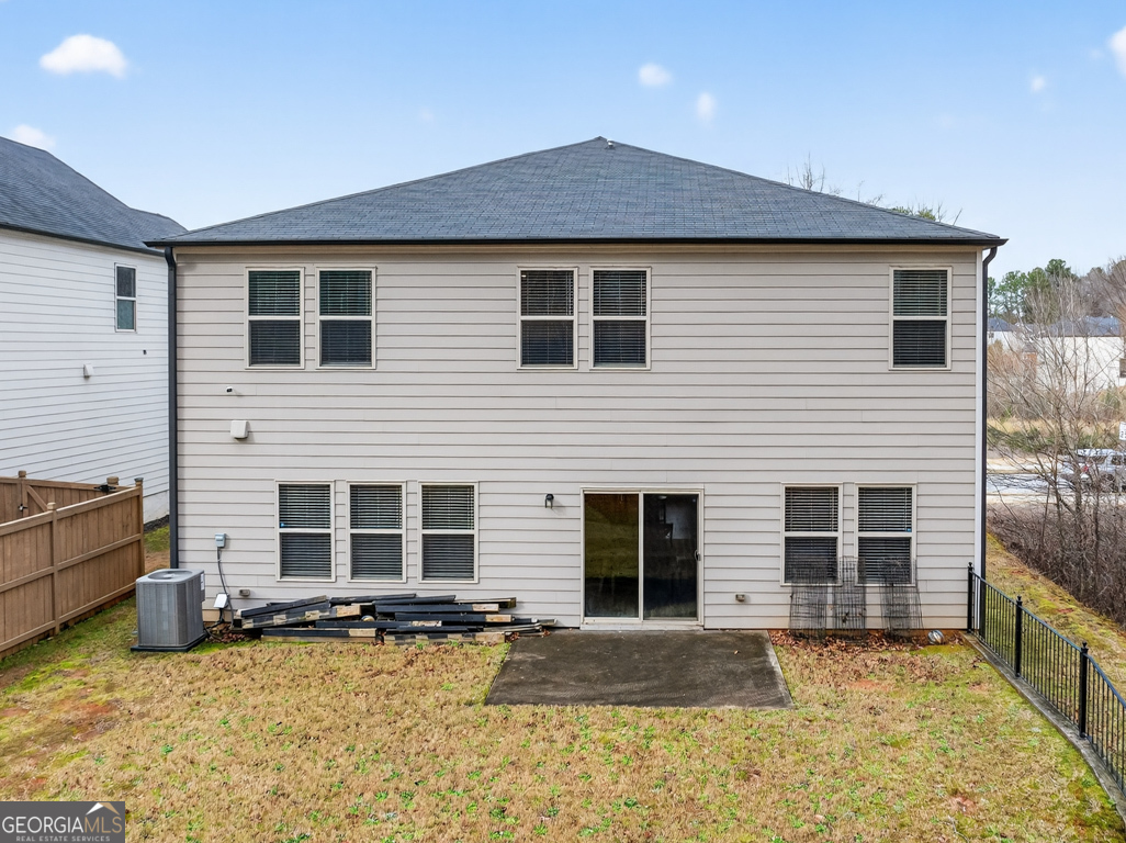 3511 Argent Way Marietta, GA 30008 - Photo 55 of 56 a front view of a house with a yard and a garage
