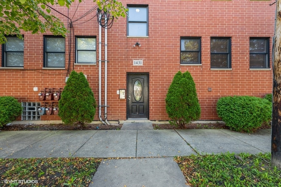 1431 West 108th Street, Unit D Chicago, IL 60643 - Photo 1 of 13 a view of a brick house with plants
