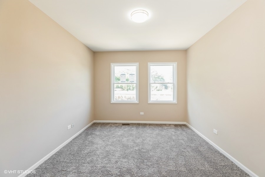 1431 West 108th Street, Unit D Chicago, IL 60643 - Photo 8 of 13 an empty room with a window