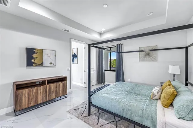 a bedroom with a bed and a view of bathroom