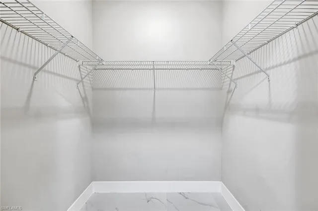 a view of a room with racks on the wall