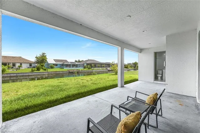 a view of a chair and table in the garden