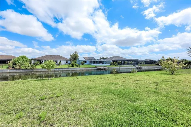 a view of a lake with a big yard