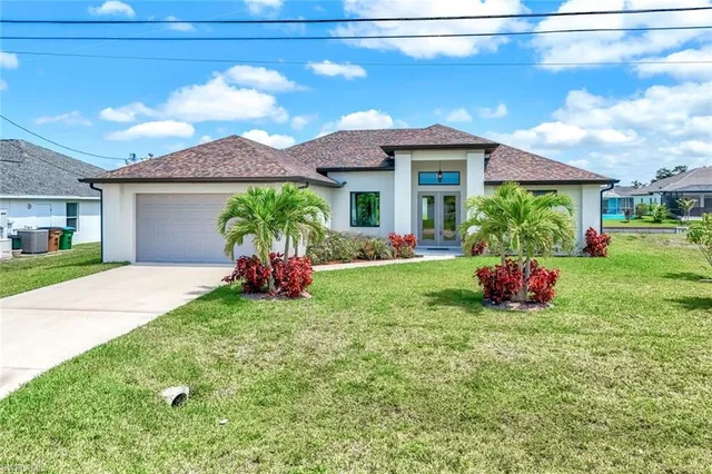 a front view of a house with swing and a big yard