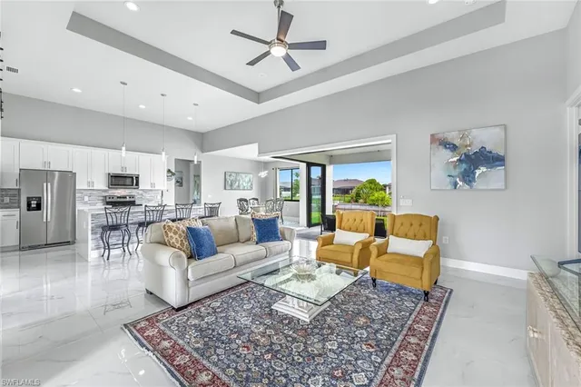 a living room with furniture and a rug