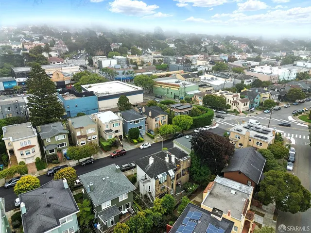 an aerial view of a city with lots of residential buildings