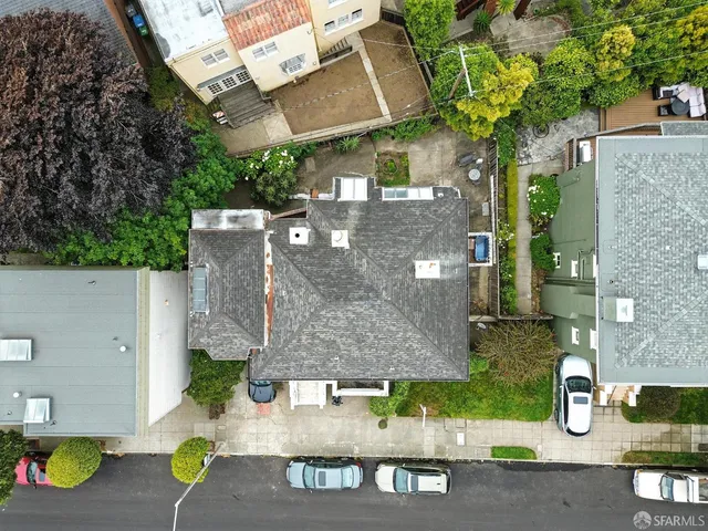an aerial view of a house with outdoor space
