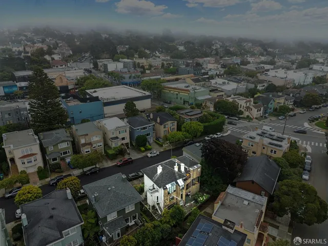 an aerial view of a city with lots of residential buildings