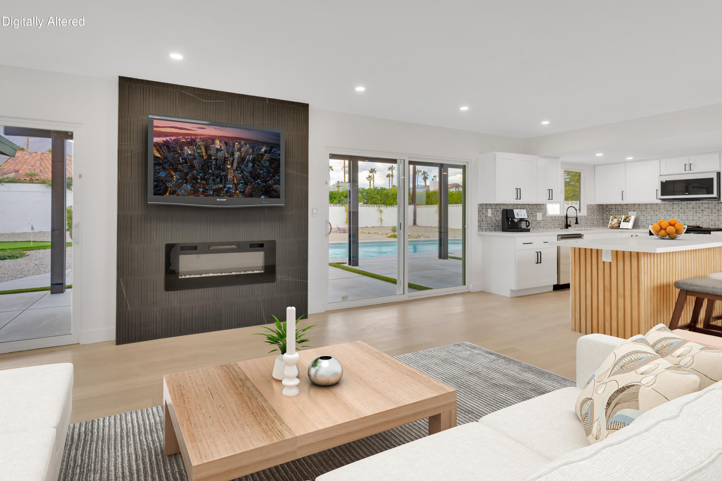 3087 North Biskra Road Palm Springs, CA 92262 - Photo 6 of 31 a living room with stainless steel appliances furniture a flat screen tv and a kitchen view