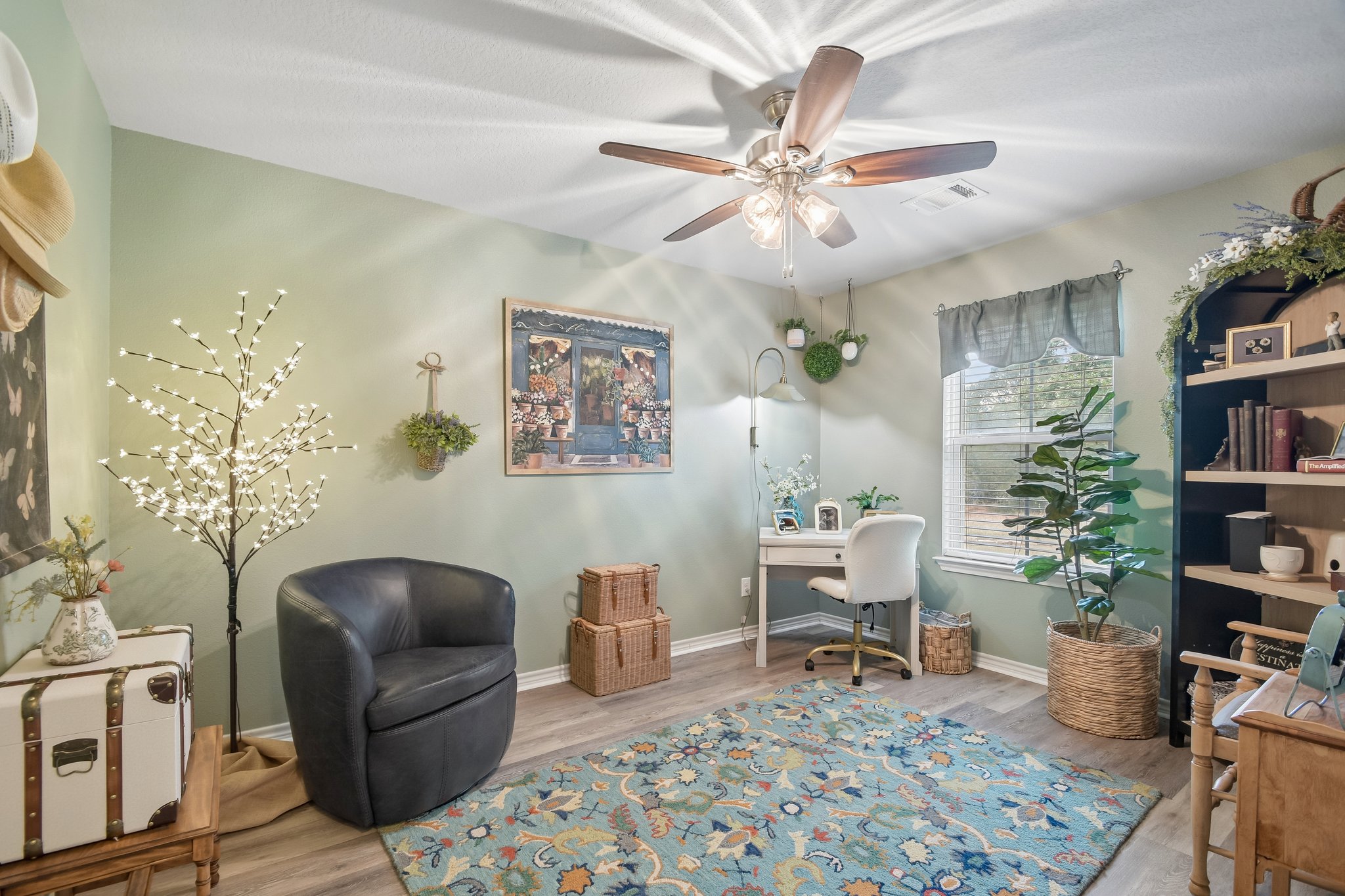 596 Pleasant Grove Loop Elgin, TX 78621 - Photo 24 of 37 Smooth wood-look flooring and a bright window bring warmth to this versatile home office.