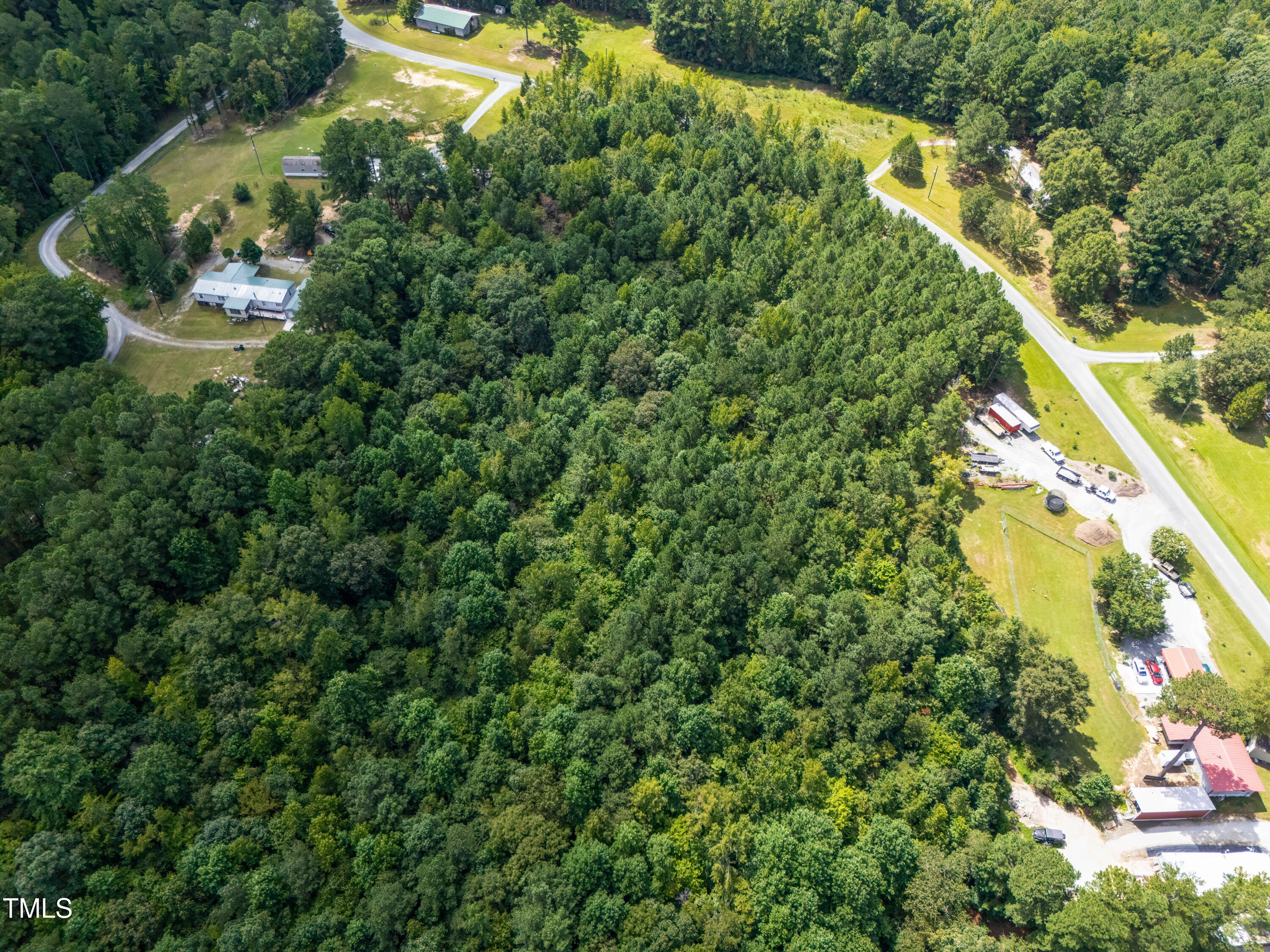 708 John Horton Road Apex, NC 27523 - Photo 3 of 11 a view of a yard with plants and large trees
