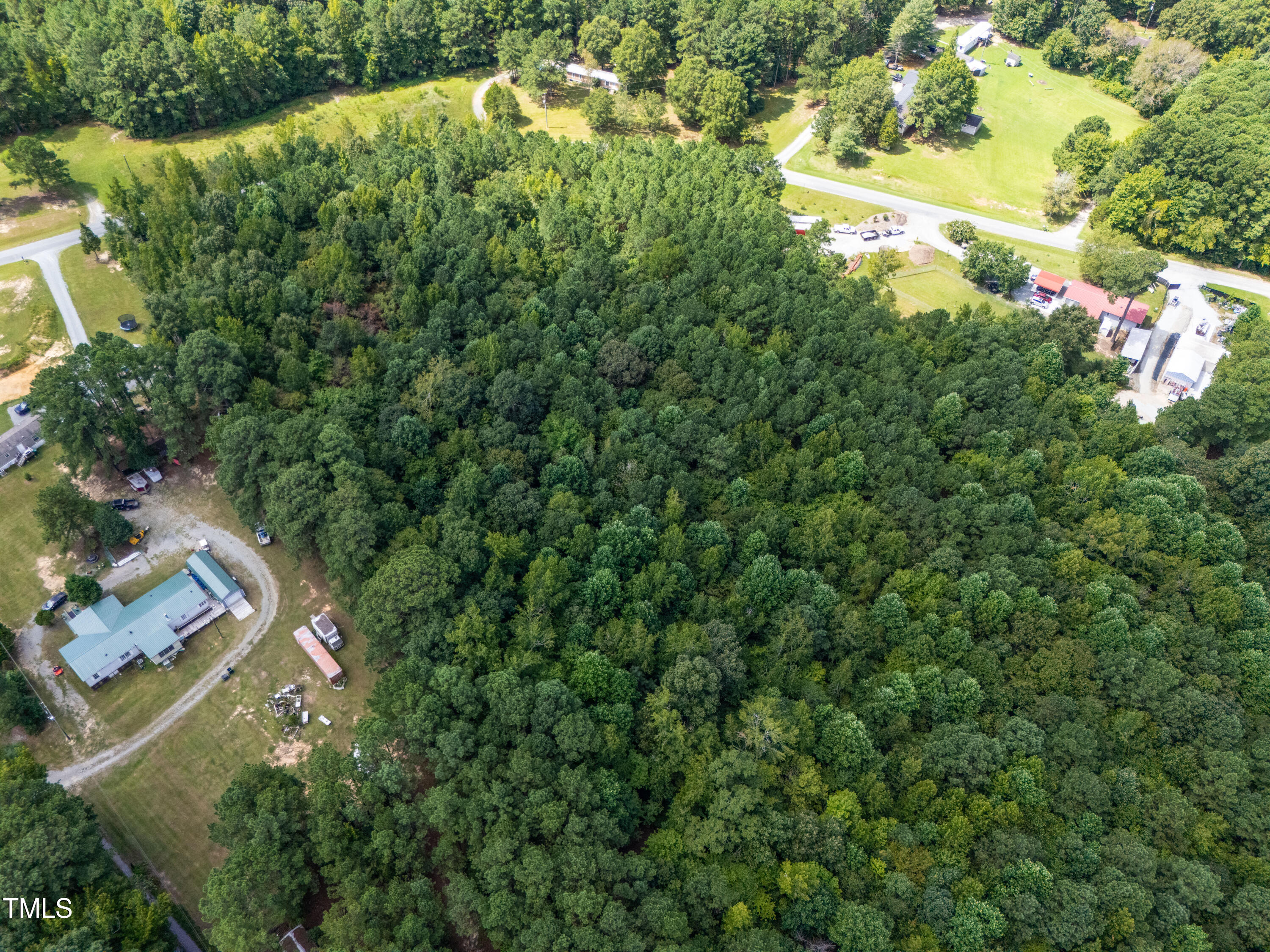 708 John Horton Road Apex, NC 27523 - Photo 6 of 11 an aerial view of residential house with outdoor space and trees all around