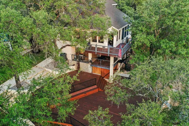 an aerial view of a house with outdoor space
