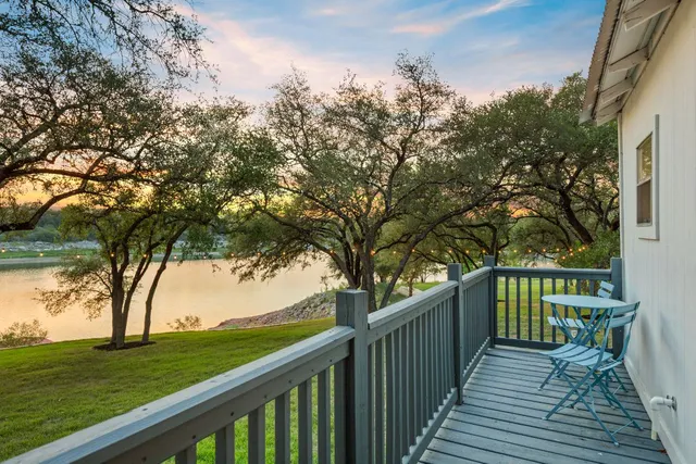 a bedroom with furniture and a flat screen tv