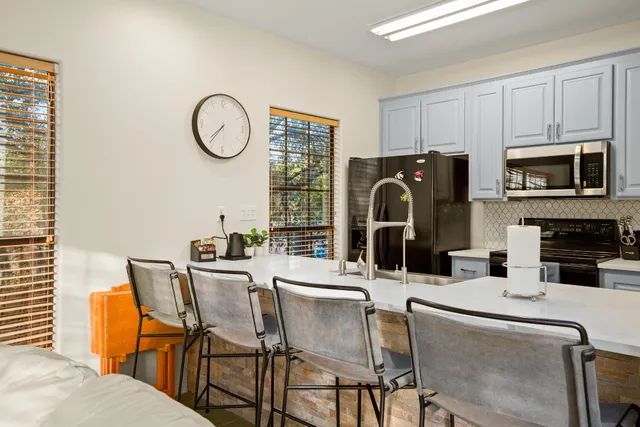 a dining room with furniture and window
