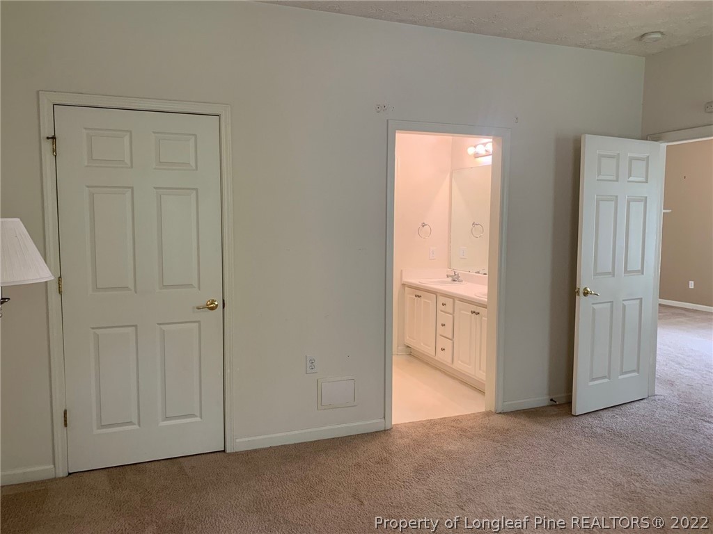 516 Lionshead Road, Unit 6 Fayetteville, NC 28311 - Photo 13 of 24 an empty room with windows and closet area