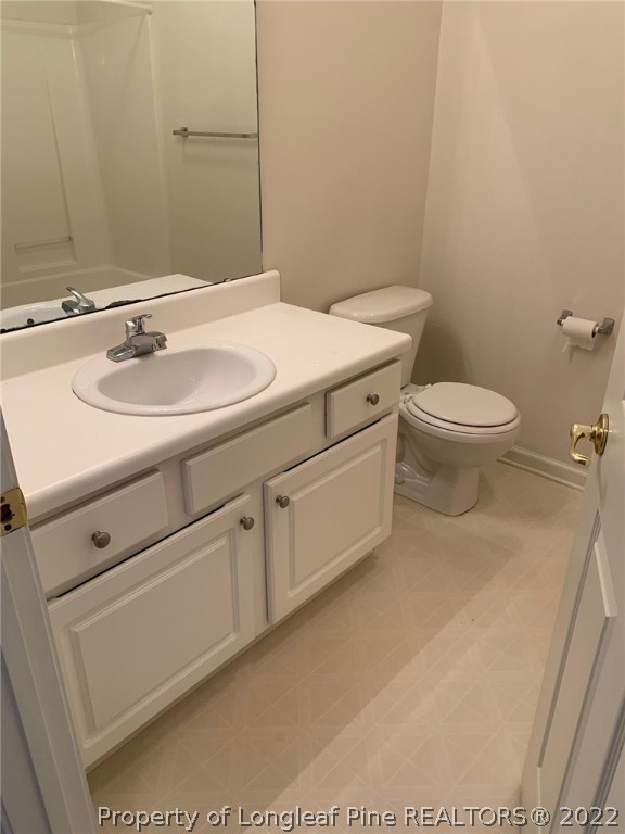 516 Lionshead Road, Unit 6 Fayetteville, NC 28311 - Photo 17 of 24 a bathroom with a sink toilet and mirror