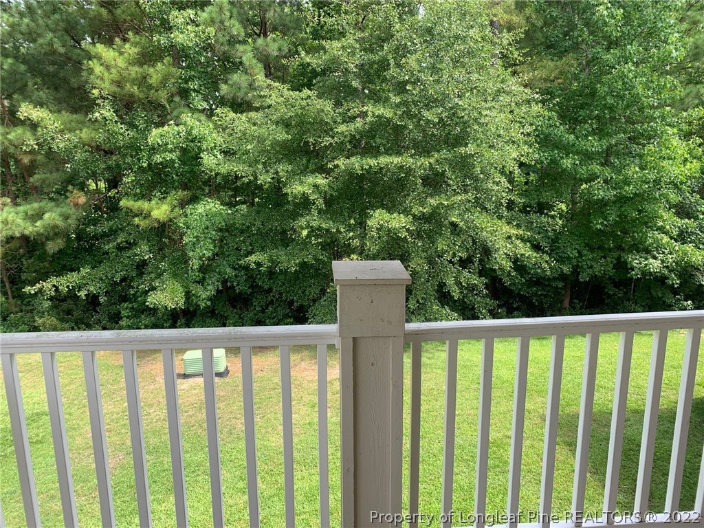 516 Lionshead Road, Unit 6 Fayetteville, NC 28311 - Photo 20 of 24 a wooden fence with trees in the background