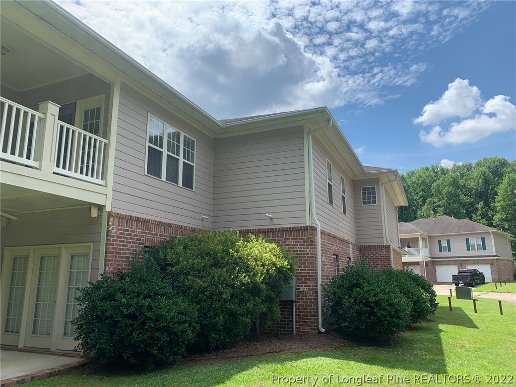 516 Lionshead Road, Unit 6 Fayetteville, NC 28311 - Photo 21 of 24 a front view of a house with garden