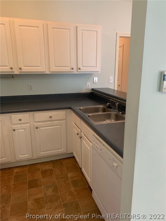 516 Lionshead Road, Unit 6 Fayetteville, NC 28311 - Photo 5 of 24 a kitchen with granite countertop white cabinets and sink