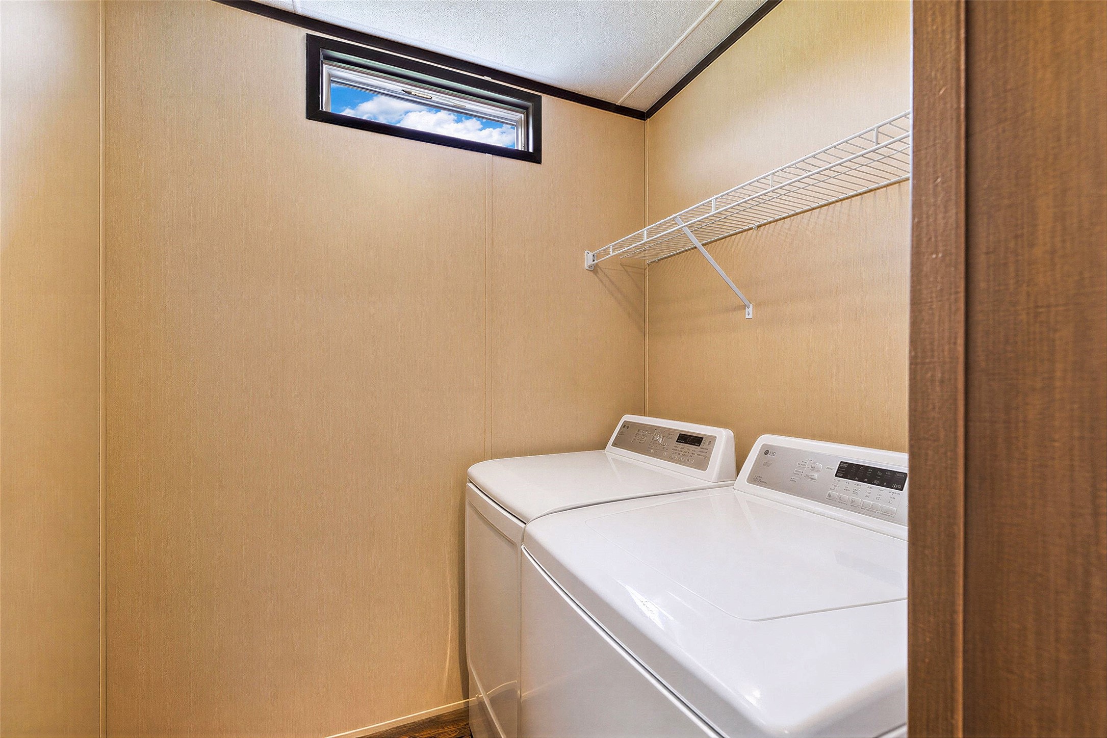 935 Lower Red Rock Road Bastrop, TX 78602 - Photo 21 of 25 A dedicated laundry room with convenient wire shelving and window for natural light.