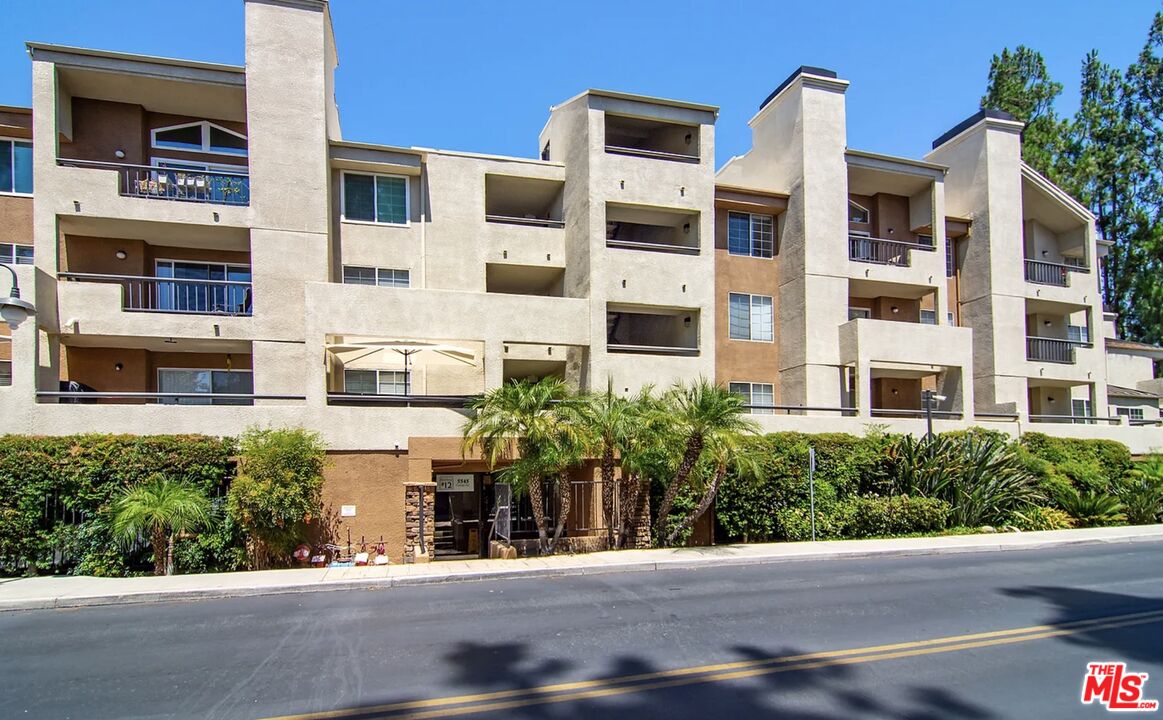 5545 Canoga Avenue, Unit 203 Woodland Hills, CA 91367 - Photo 2 of 12 a view of street with building in front of it