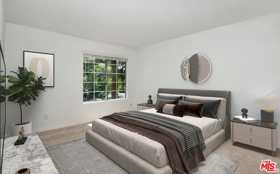 5545 Canoga Avenue, Unit 203 Woodland Hills, CA 91367 - Photo 6 of 12 a bedroom with bed and a window