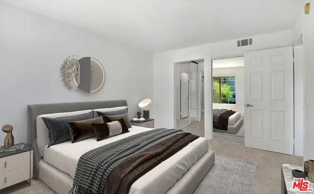 a bedroom with bed and window