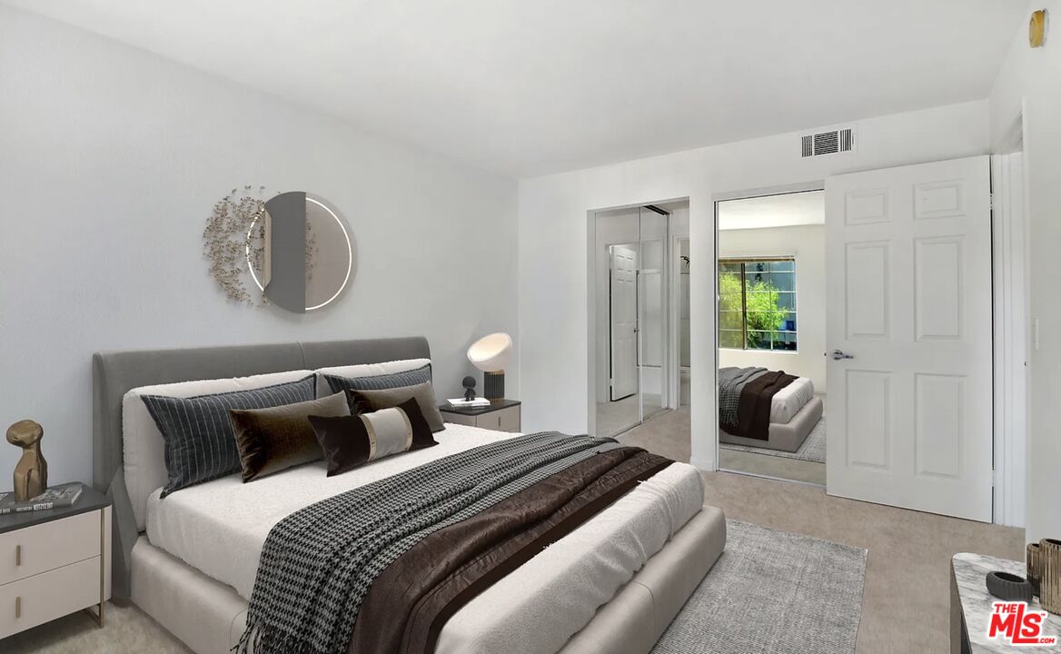 5545 Canoga Avenue, Unit 203 Woodland Hills, CA 91367 - Photo 7 of 12 a bedroom with bed and window