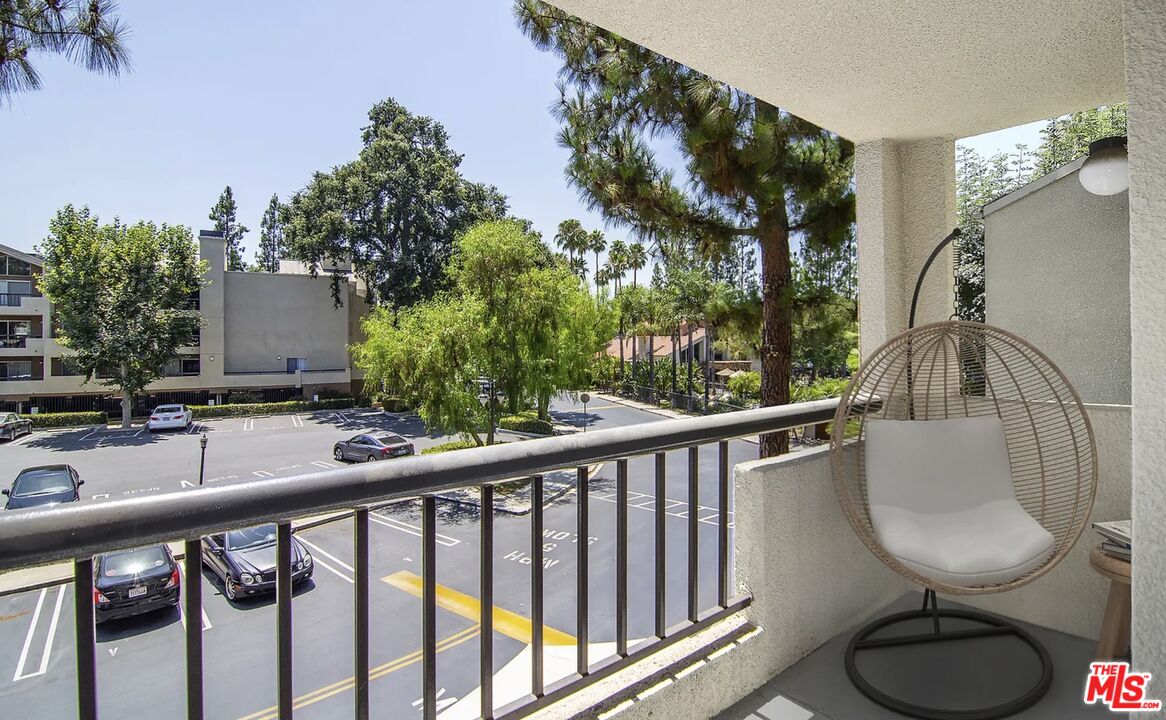 5545 Canoga Avenue, Unit 203 Woodland Hills, CA 91367 - Photo 10 of 12 a view of a balcony and chairs