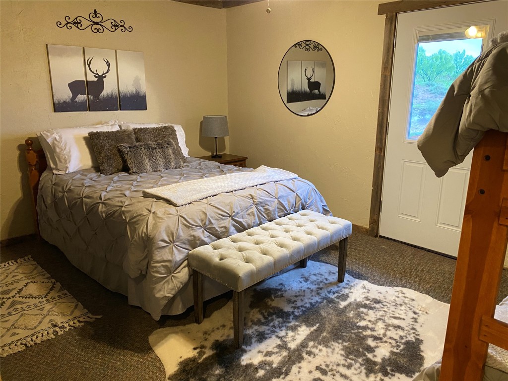 906 C R 235 Old Glory, TX 79540 - Photo 15 of 40 a bedroom with a bed and a painting on the wall