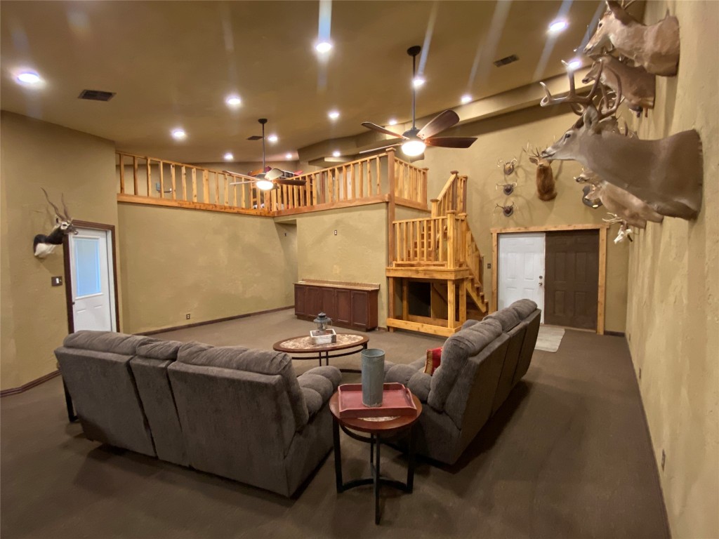 906 C R 235 Old Glory, TX 79540 - Photo 29 of 40 a living room with furniture a fireplace and a chandelier