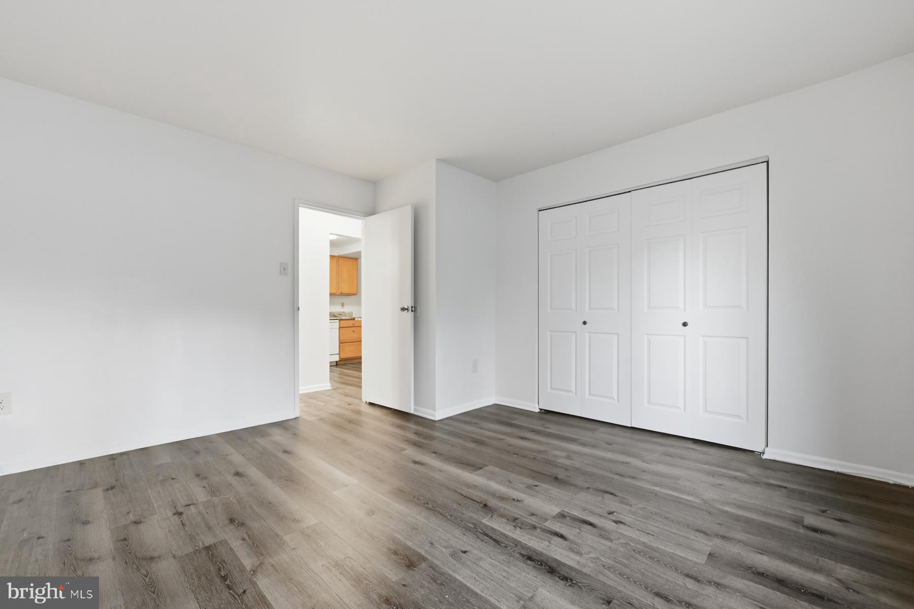 2570 Riva Road, Unit 3C Annapolis, MD 21401 - Photo 14 of 17 a view of an empty room with wooden floor