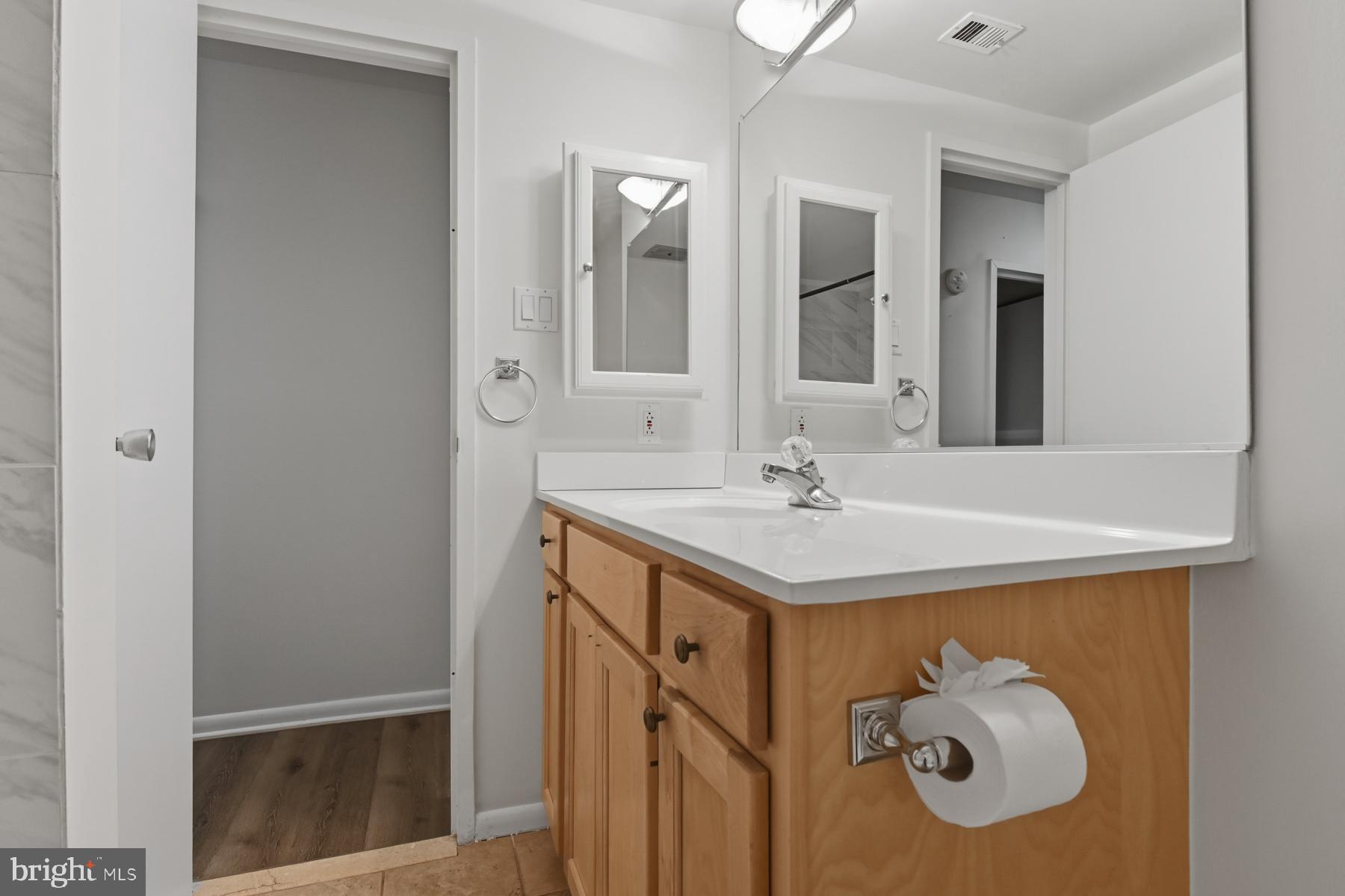 2570 Riva Road, Unit 3C Annapolis, MD 21401 - Photo 16 of 17 a bathroom with a sink vanity and mirror