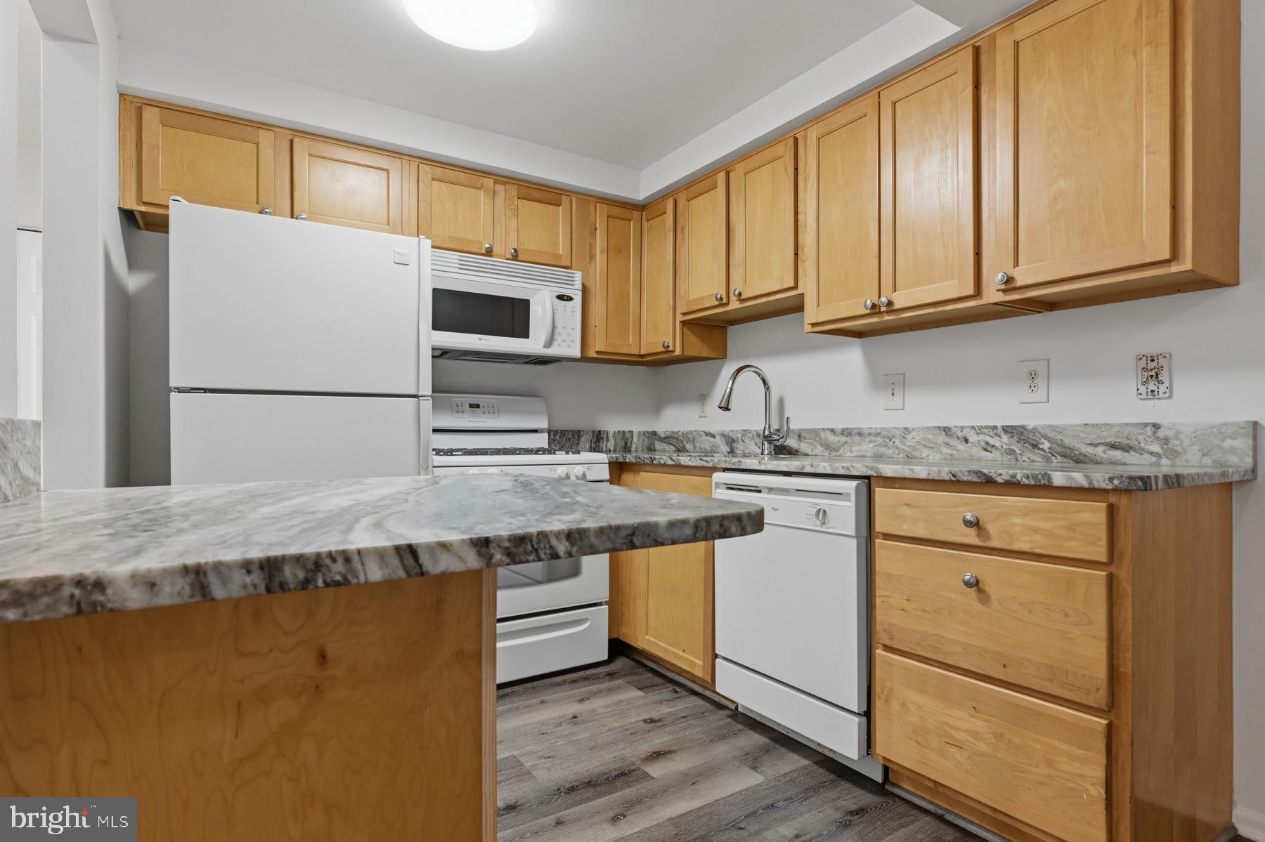 2570 Riva Road, Unit 3C Annapolis, MD 21401 - Photo 3 of 17 a kitchen with granite countertop cabinets stainless steel appliances and a sink