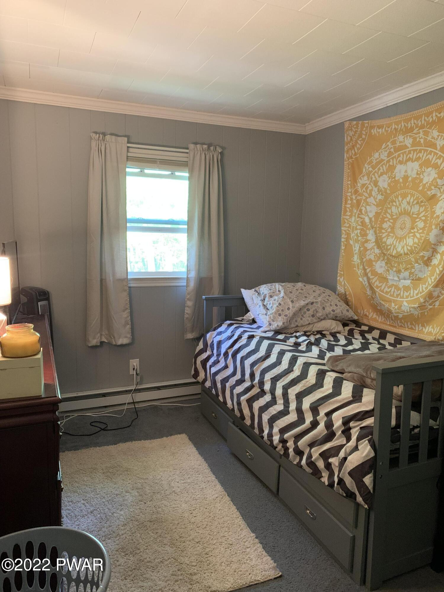 116 Red Pine Road Dingmans Ferry, PA 18328 - Photo 15 of 23 a bedroom with a bed and two windows