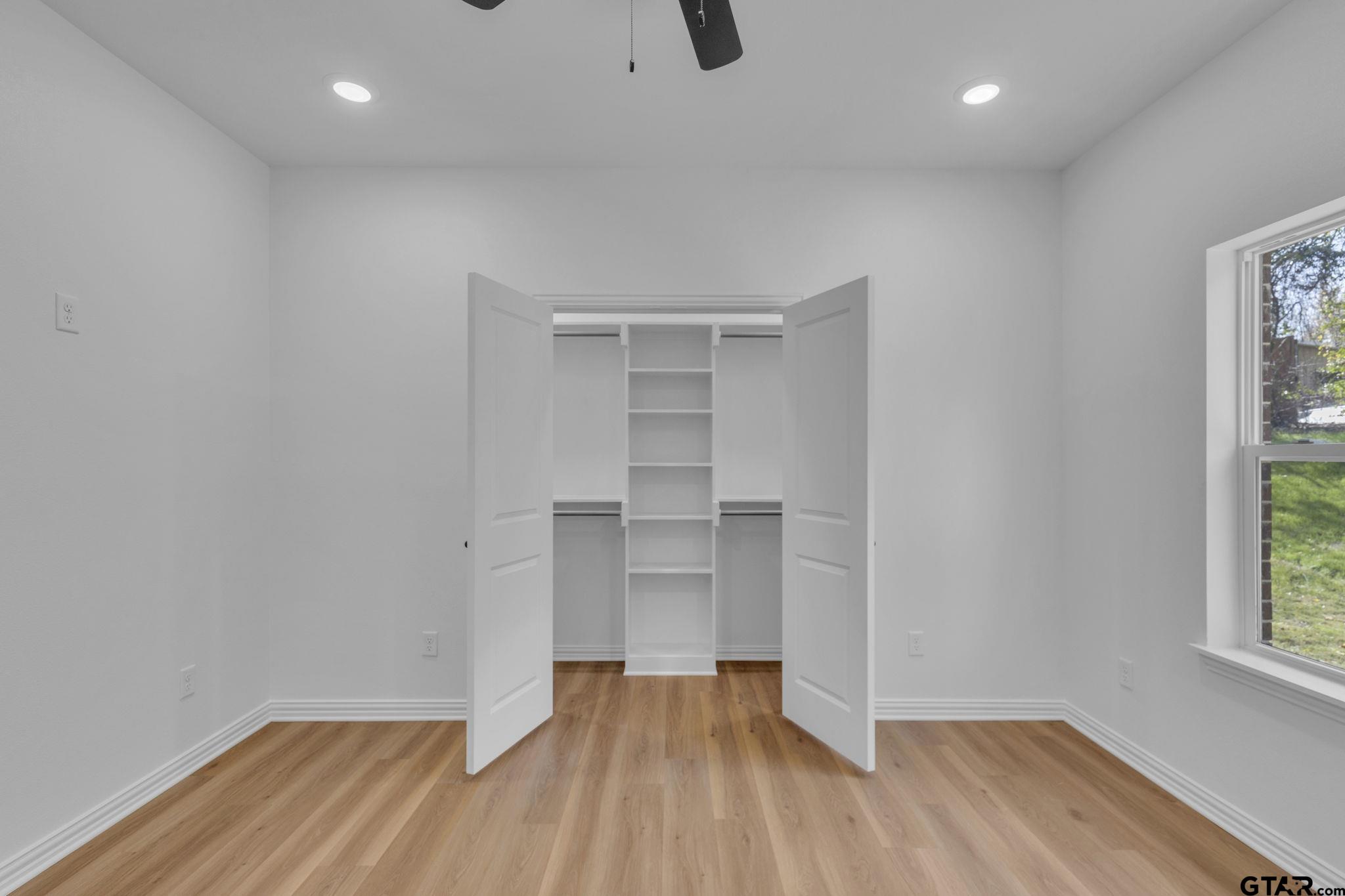 1410 West Connally Street Tyler, TX 75701 - Photo 20 of 29 a view of empty room with wooden floor and fan