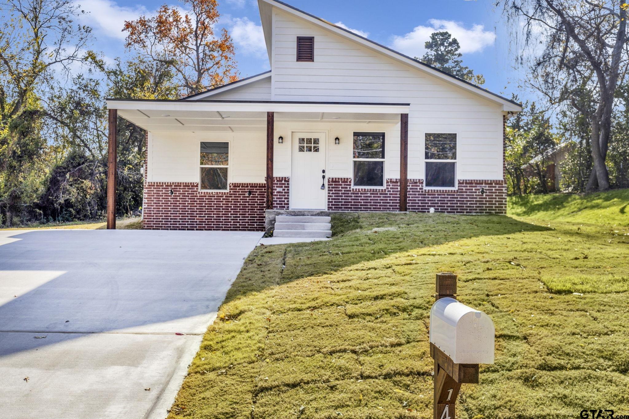 1410 West Connally Street Tyler, TX 75701 - Photo 2 of 29 a front view of a house with garden